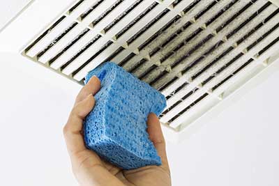 hvac air vents being cleaned as part of the AC spring time check list