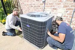 Extreme Comfort Air Conditioning & Heating technicians delivering and installing new ac system in home